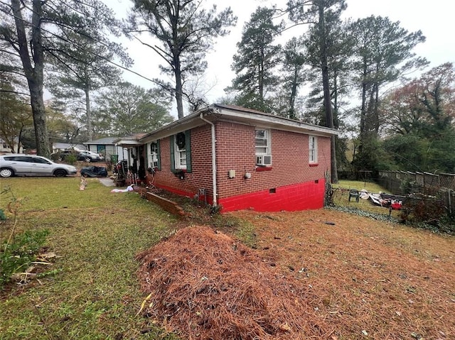 view of side of home featuring a lawn