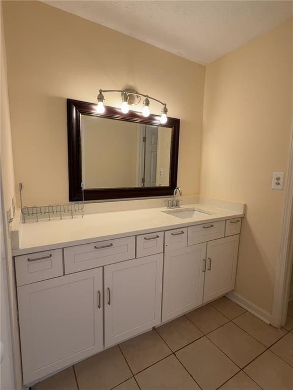 bathroom with tile patterned flooring and vanity