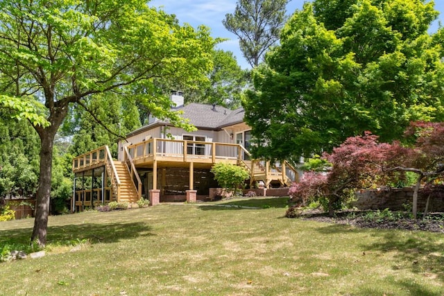 490 Rock Springs Rd NE, Atlanta, GA 30324 - rear view of property featuring a wooden deck, stairs, a chimney, and a lawn