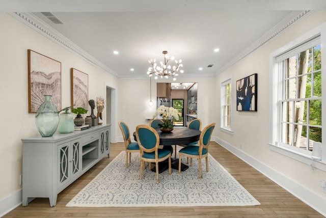 490 Rock Springs Rd NE, Atlanta, GA 30324 - dining space featuring visible vents, ornamental molding, and a healthy amount of sunlight