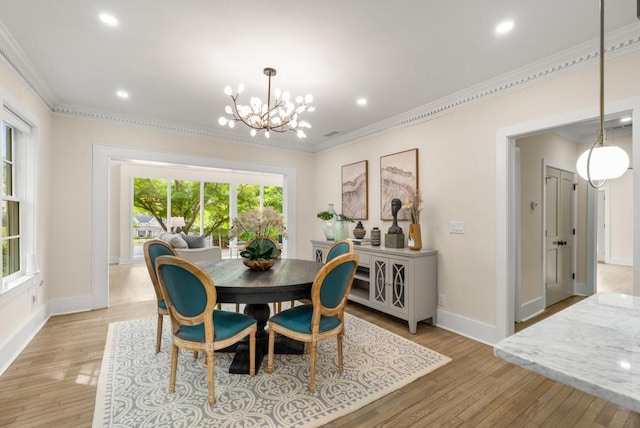 490 Rock Springs Rd NE, Atlanta, GA 30324 - dining area featuring crown molding, baseboards, a notable chandelier, and light wood-type flooring
