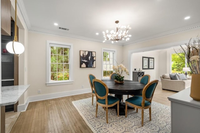 490 Rock Springs Rd NE, Atlanta, GA 30324 - dining room with a healthy amount of sunlight, ornamental molding, a notable chandelier, and visible vents