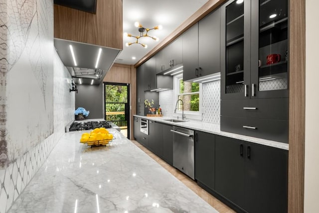 490 Rock Springs Rd NE, Atlanta, GA 30324 - kitchen featuring a sink, dark cabinetry, decorative backsplash, and dishwasher