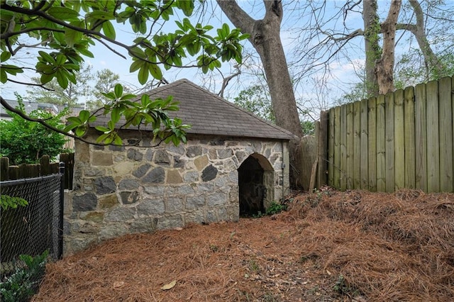 view of outdoor structure featuring fence