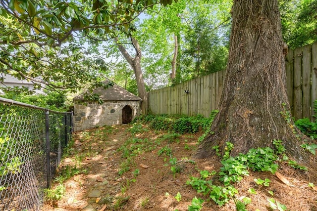 490 Rock Springs Rd NE, Atlanta, GA 30324 - view of yard with an outbuilding, a fenced backyard, and a shed
