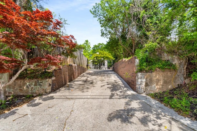 490 Rock Springs Rd NE, Atlanta, GA 30324 - view of road with a gate, a gated entry, and aphalt driveway