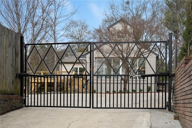 view of gate with fence