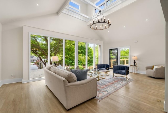 490 Rock Springs Rd NE, Atlanta, GA 30324 - living area with plenty of natural light, light wood finished floors, a notable chandelier, and high vaulted ceiling