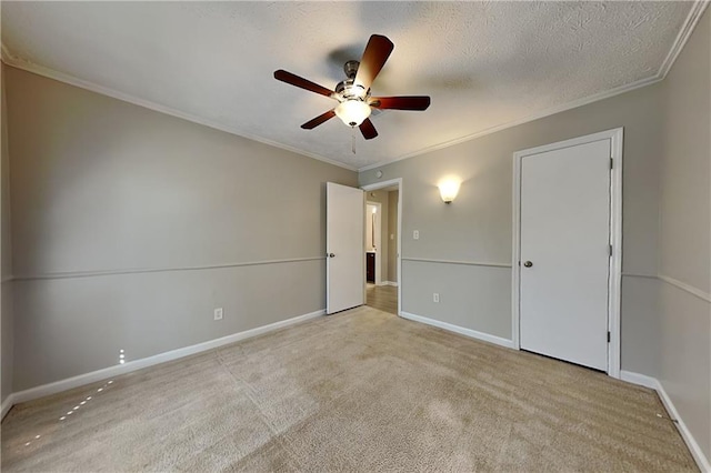 unfurnished bedroom with light carpet, ceiling fan, and crown molding