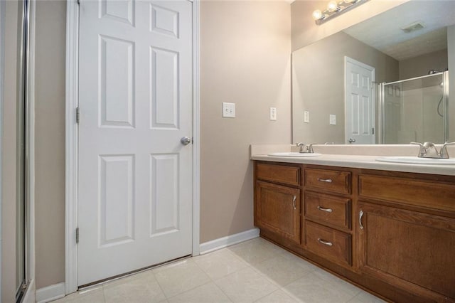 bathroom with vanity and an enclosed shower