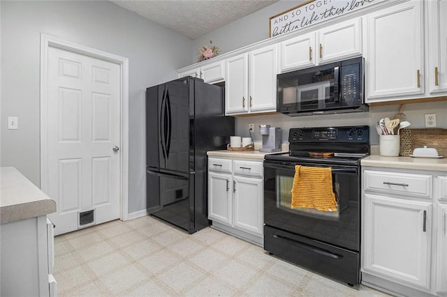 kitchen with white cabinetry, black appliances, and a textured ceiling