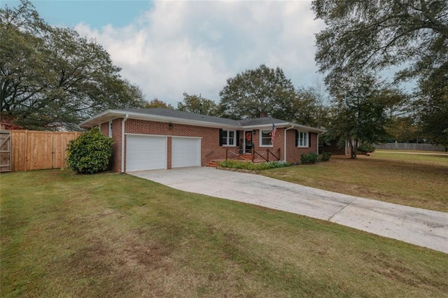 ranch-style house featuring a garage and a front lawn