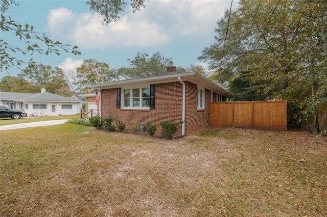 view of home's exterior with a lawn