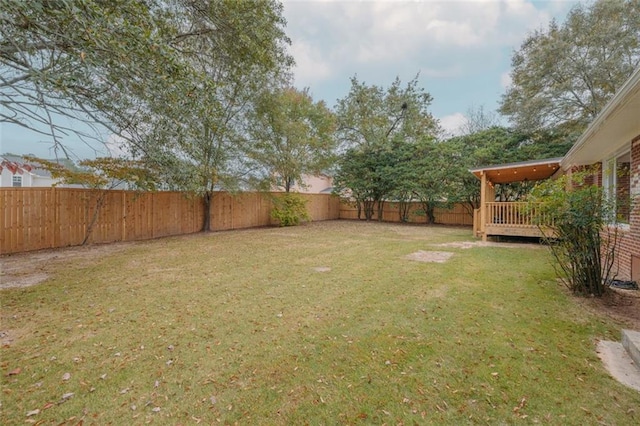 view of yard with a deck