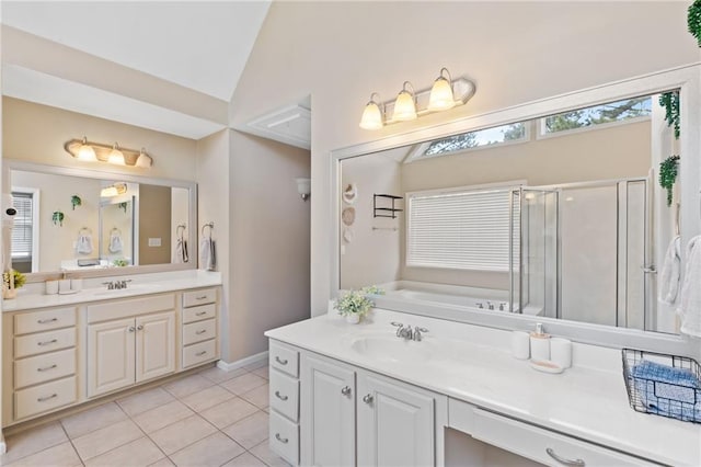 full bathroom featuring vanity, a stall shower, tile patterned flooring, lofted ceiling, and a garden tub