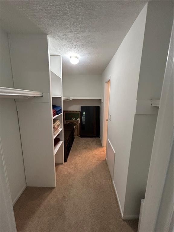 6851 Roswell Rd Unit O10, Atlanta, GA 30328 - hallway featuring light colored carpet and a textured ceiling