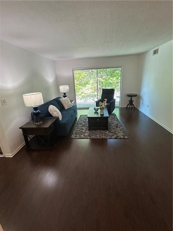 6851 Roswell Rd Unit O10, Atlanta, GA 30328 - living room with wood finished floors and a textured ceiling
