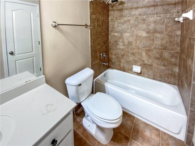 full bathroom featuring toilet, vanity, tile patterned flooring, and tiled shower / bath combo