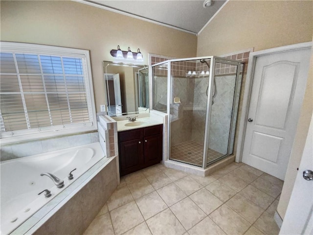 bathroom featuring separate shower and tub, tile patterned flooring, lofted ceiling, and vanity