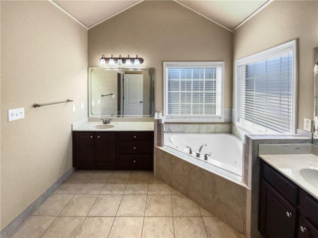 bathroom with ornamental molding, vanity, lofted ceiling, and tile patterned floors