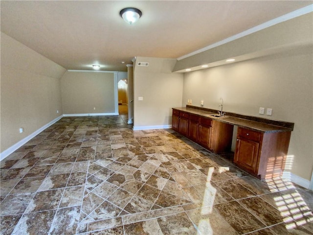 bar with lofted ceiling and sink