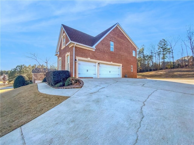 view of side of property featuring a garage