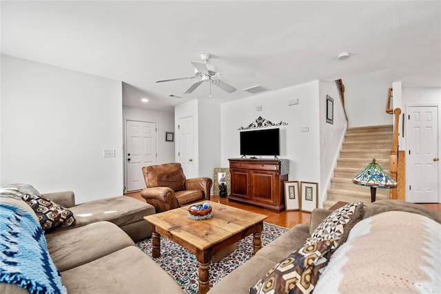 living room featuring hardwood / wood-style flooring and ceiling fan