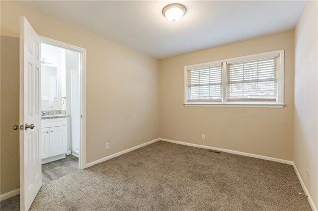 453 Utoy Cir SW, Atlanta, GA 30331 - empty room with light colored carpet