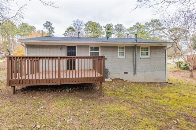 453 Utoy Cir SW, Atlanta, GA 30331 - back of house featuring central air condition unit, a yard, and a wooden deck