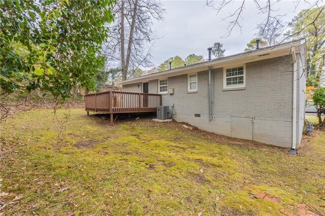 453 Utoy Cir SW, Atlanta, GA 30331 - back of house with a yard, central AC, and a wooden deck