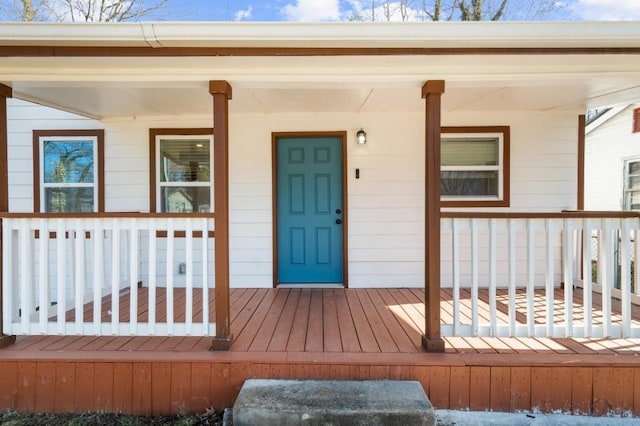 view of exterior entry featuring a porch