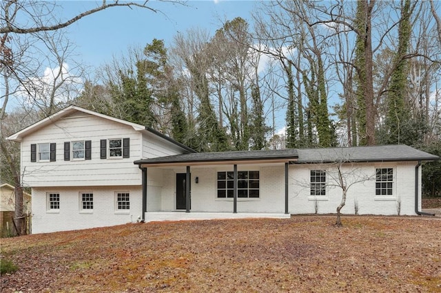 split level home featuring a patio