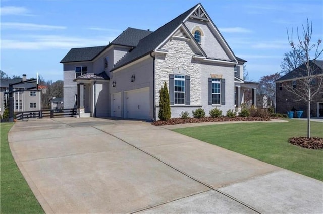 6355 Westfallen Overlook, Cumming, GA 30040 - view of front of home with stone siding, driveway, and a front yard
