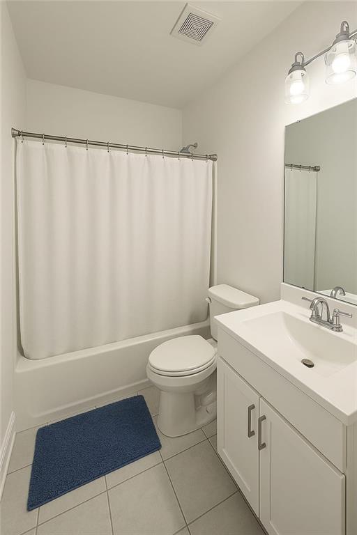 6355 Westfallen Overlook, Cumming, GA 30040 - full bathroom with toilet, shower / tub combo, visible vents, tile patterned flooring, and vanity