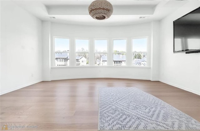6355 Westfallen Overlook, Cumming, GA 30040 - empty room with visible vents, wood finished floors, and baseboards