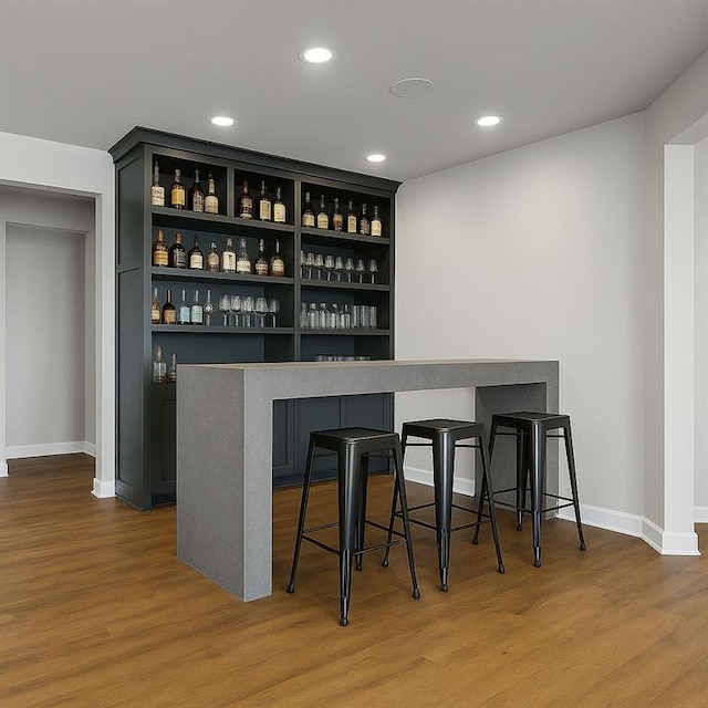 6355 Westfallen Overlook, Cumming, GA 30040 - bar with baseboards, recessed lighting, and wood finished floors
