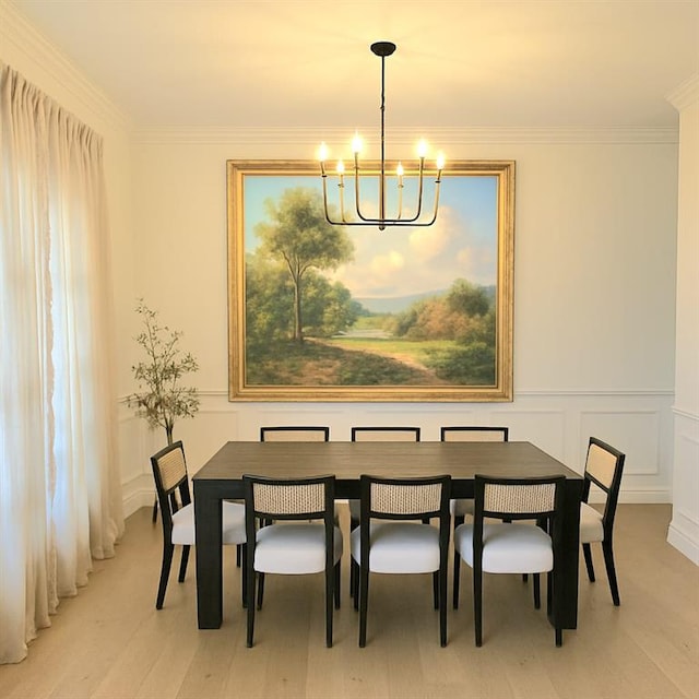 6355 Westfallen Overlook, Cumming, GA 30040 - dining area with an inviting chandelier, a decorative wall, wainscoting, light wood-style floors, and ornamental molding