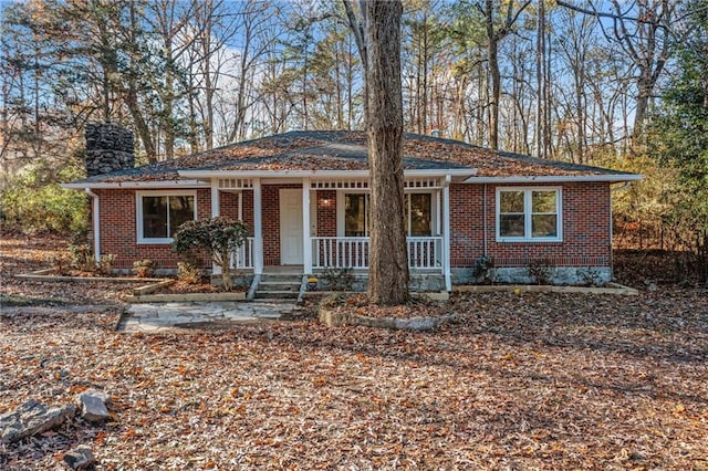 ranch-style home featuring a porch