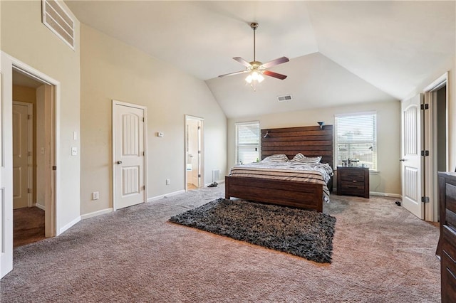 bedroom with ensuite bathroom, carpet floors, high vaulted ceiling, and ceiling fan