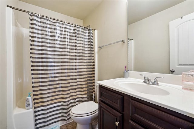 full bathroom featuring vanity, shower / bath combo, and toilet