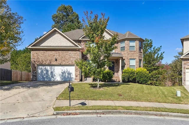 view of front of property with a front lawn and a garage