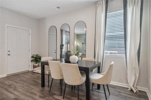 dining room featuring dark hardwood / wood-style flooring