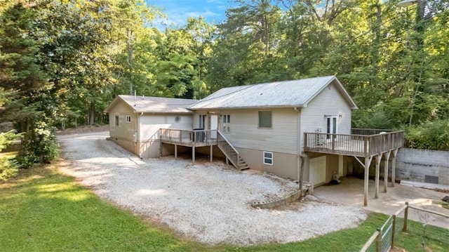 170 Early Sundown Rd, Clarkesville, GA 30523 - rear view of house with stairway, a wooden deck, and a metal roof