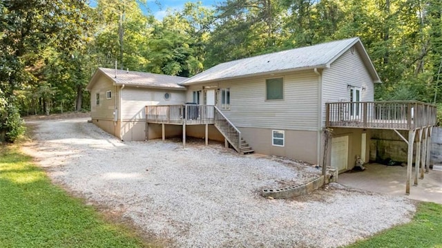 170 Early Sundown Rd, Clarkesville, GA 30523 - rear view of property featuring a wooden deck, stairs, a metal roof, driveway, and an attached garage