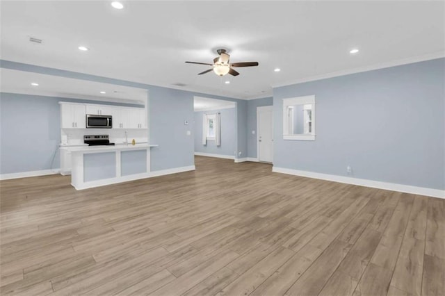 170 Early Sundown Rd, Clarkesville, GA 30523 - unfurnished living room featuring ceiling fan, light wood-style floors, recessed lighting, and crown molding