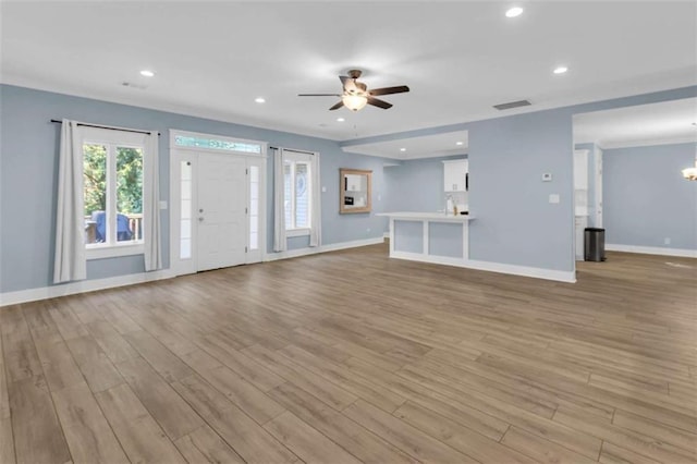 170 Early Sundown Rd, Clarkesville, GA 30523 - unfurnished living room with ceiling fan, light wood-style floors, recessed lighting, and a chandelier