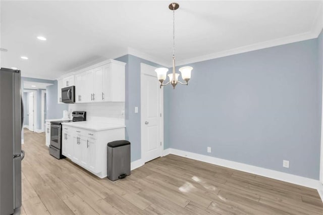 170 Early Sundown Rd, Clarkesville, GA 30523 - kitchen with appliances with stainless steel finishes, a chandelier, light countertops, white cabinetry, and recessed lighting