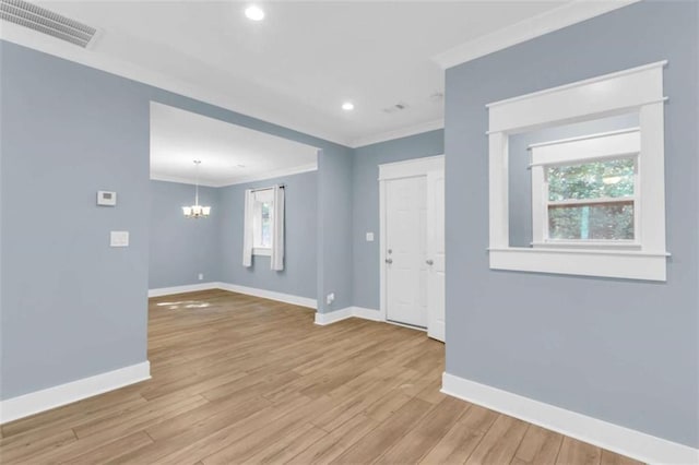 170 Early Sundown Rd, Clarkesville, GA 30523 - spare room with crown molding, a chandelier, light wood-style floors, and recessed lighting