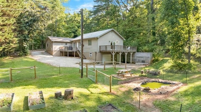 170 Early Sundown Rd, Clarkesville, GA 30523 - rear view of property featuring a deck, a vegetable garden, and stairway
