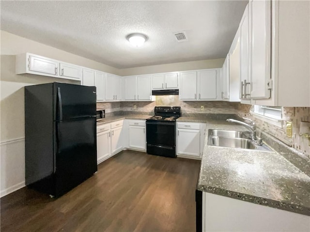 kitchen with sink, black appliances, and white cabinets